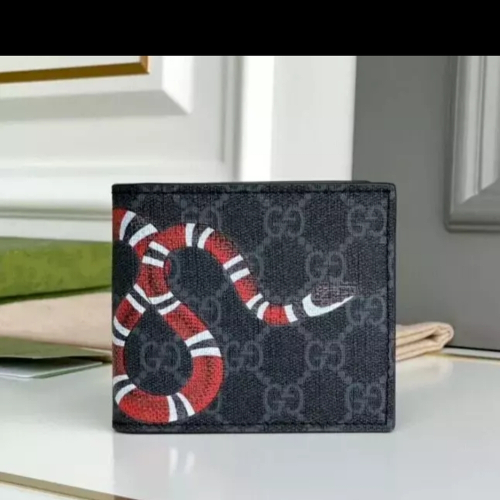 Gucci Supreme snake wallet.